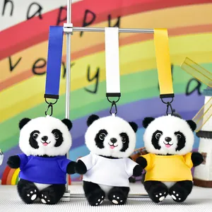 Three cute panda plush bag charms wearing colorful blue, white, and yellow t-shirts.