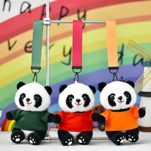 Detailed view of cute panda plush keychains wearing green, red, and orange t-shirts