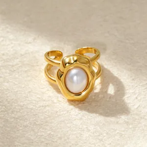 Macro view of a 14K gold-plated irregular bezel ring with a lustrous central pearl