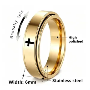 Detail of golden stainless steel cross spinner ring with 6mm width and high polish