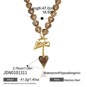 Detailed product view of heart pendant necklace with measurements and material specs