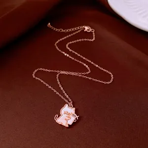 Detailed view of rose gold cat pendant necklace featuring elegant white shell inlay
