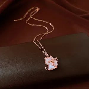 Detailed view of a rose gold cat pendant necklace with a shimmering shell inlay