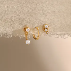 Detailed view of 18k gold plated stainless steel stud and hoop earring set with CZ stones