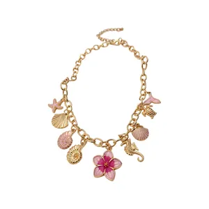 Gold-plated summer ocean theme necklace with pink enamel flower and seashell charms