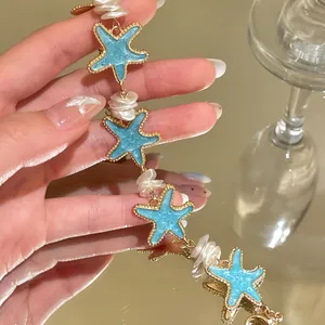 Stunning detailed view of mint blue starfish bracelet with unique baroque pearls