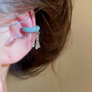 Stunning blue beaded ear cuff jewelry featuring elegant silver chain tassels and charms