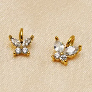 Detailed macro view of 14K gold plated butterfly pendants with sparkling cubic zirconia