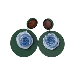 Retro resin floral drop earrings with blue rose design on green circular base studs.