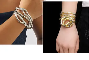 Close-up of flexible snake-shaped metallic jewelry worn as a stylish coiled bracelet