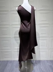 Close-up back view of elegant brown satin evening dress showing draped fabric detail