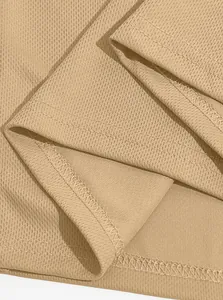 Close-up of khaki bird-eye mesh fabric showing fine stitching on a tactical polo shirt