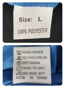 Detailed close-up of a care label on a blue mesh sports Polo shirt showing L size