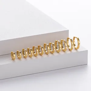 Close-up of multiple sizes of minimalist gold-plated S925 sterling silver hoop earrings