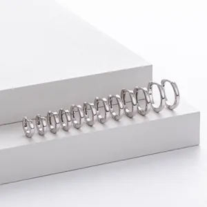 Minimalist S925 sterling silver hoop earrings in multiple sizes on white display blocks