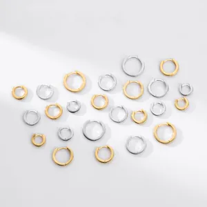 Assorted sterling silver hoop earrings in gold and silver finishes, various sizes detail
