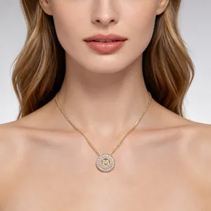 Elegant gold-tone round pendant necklace featuring a pavé zircon letter M initial