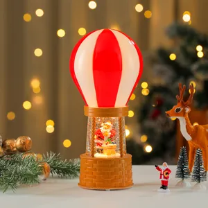 Festive Christmas hot air balloon snow globe night light with Santa Claus figure.