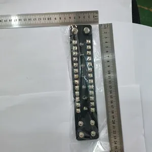 Punk rock black leather bracelet with silver square studs measured with metal rulers