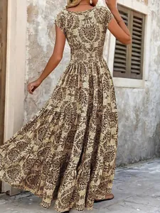 Detailed back view of a bohemian retro floral print maxi dress featuring tiered skirt