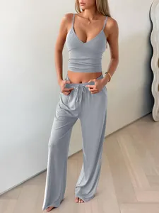 Light blue two-piece lounge set with V-neck camisole and wide-leg yoga pants.