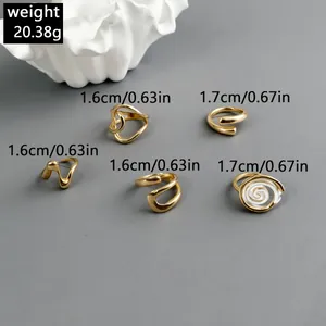 Macro detail showing irregular hollow gold ring set with dimensions and weight info