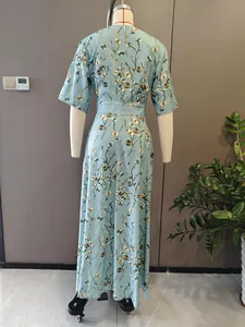 Back view of elegant light blue floral print short sleeve maxi dress on mannequin