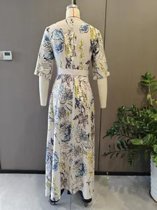 Full back view of an elegant floral print slim maxi dress on mannequin