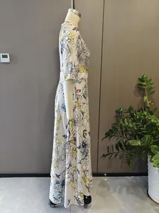 Detailed side view of an elegant floral V-neck maxi dress with short sleeves and empire waist.