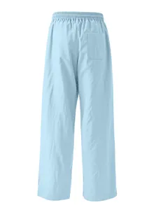 Rear view of light blue casual linen pants showing elastic waist and back pocket