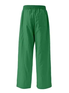Back view of men's loose green linen casual pants with elastic waist and back pocket