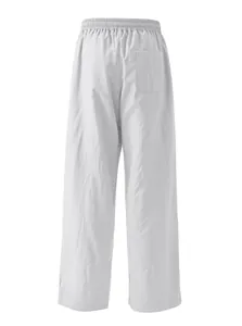 Detailed back view of men's loose linen casual trousers with elastic waist and pocket