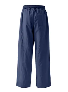 Back view of navy blue men's loose linen pants showing back pocket and elastic waist
