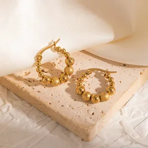 Luxury golden titanium steel beaded hoop earrings featuring smooth and frosted finishes