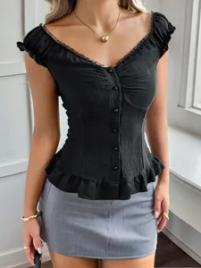 Close-up detail of a Y2K black sleeveless top with ruffled trim and button front