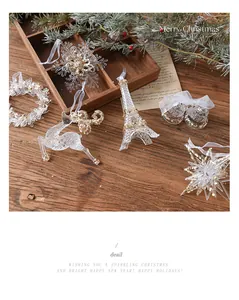Close-up of sparkling acrylic Christmas ornaments including reindeer and snowflakes