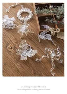 Detailed view of elegant clear acrylic Christmas ornaments with gold glitter