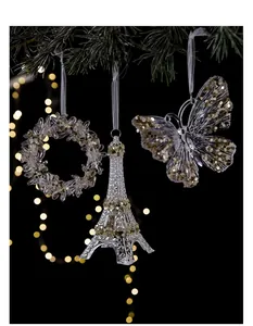 Detailed view of acrylic Christmas ornaments like Eiffel Tower and butterfly with sequins