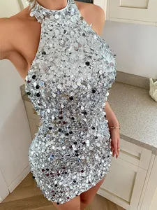 Detailed view of elegant silver sequin halter neck mini dress with shiny reflective paillettes.