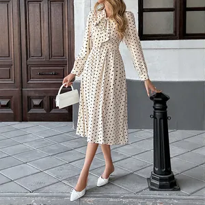 Elegante abito midi a pois in stile vintage con maniche lunghe e fiocco per donna.