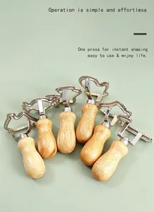 Detailed view of various zinc alloy cookie and ravioli cutters with wooden handles