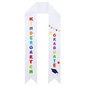 White satin kindergarten graduation sash with colorful printed lettering and stars