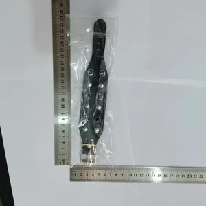 Detailed view of black punk rock leather bracelet for men with measuring ruler for size