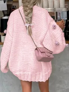 Elegant pink chunky knit sweater featuring delicate floral applique details for autumn/winter