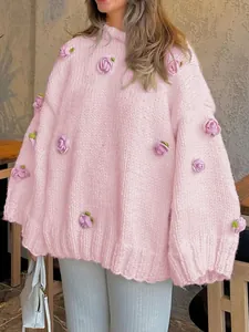 Elegant pink long-sleeve chunky knit sweater featuring detailed 3D crochet rose appliques