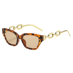 Stylish tortoiseshell cat-eye sunglasses for men and women with gold chain-link temples.