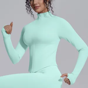 Detail of mint green slim-fit yoga jacket with stand collar and zipper closure
