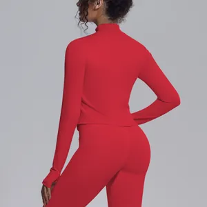 Back view of a red slim fit mock neck long sleeve yoga jacket for women's fitness