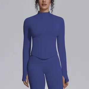 Close-up detail of a slim fit blue yoga jacket featuring a zipper and thumb holes