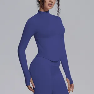Detailed view of the athletic fit and thumb hole cuffs on a blue women's yoga jacket
